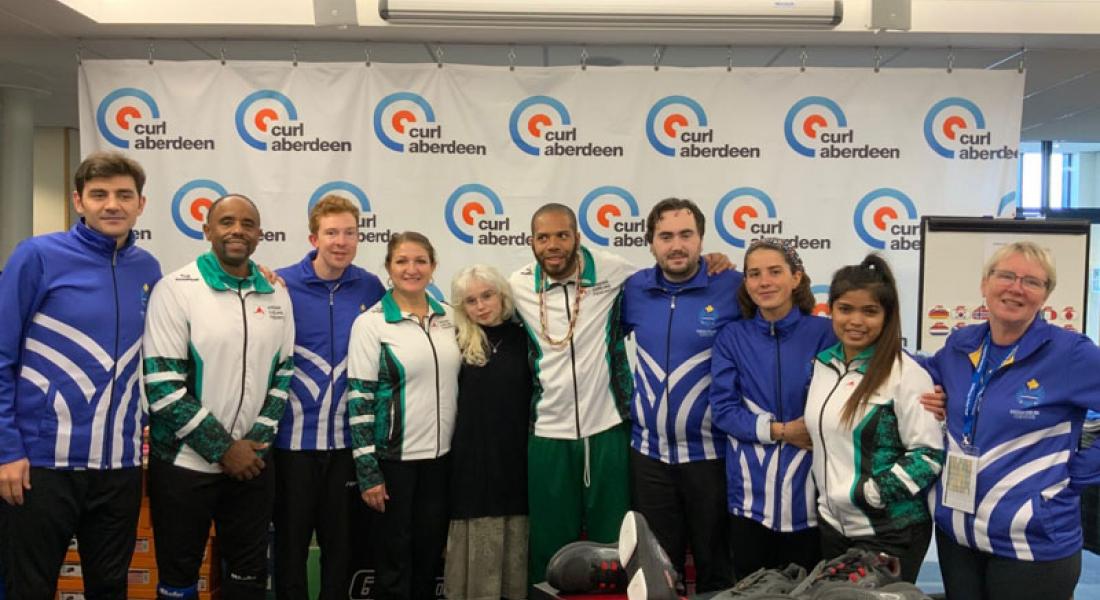 Team Nigeria with Team Kosovo at the World Mixed Curling Championship 2019, Aberdeen, Scotland